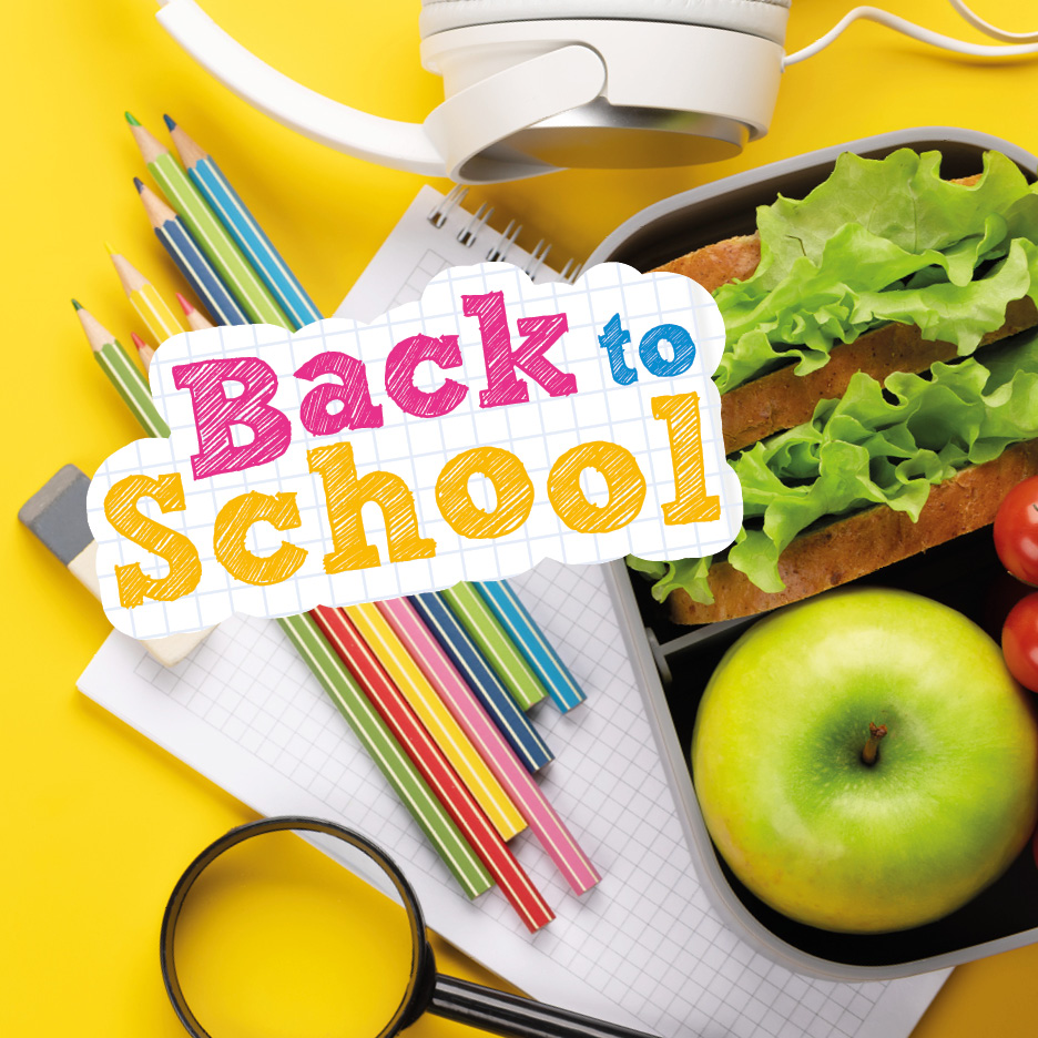 Forniture scolastiche e pranzo al sacco con la scritta 'Back to School'.